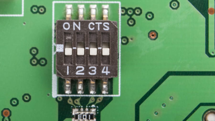 Surface mounted switch on electronic circuit board close-up